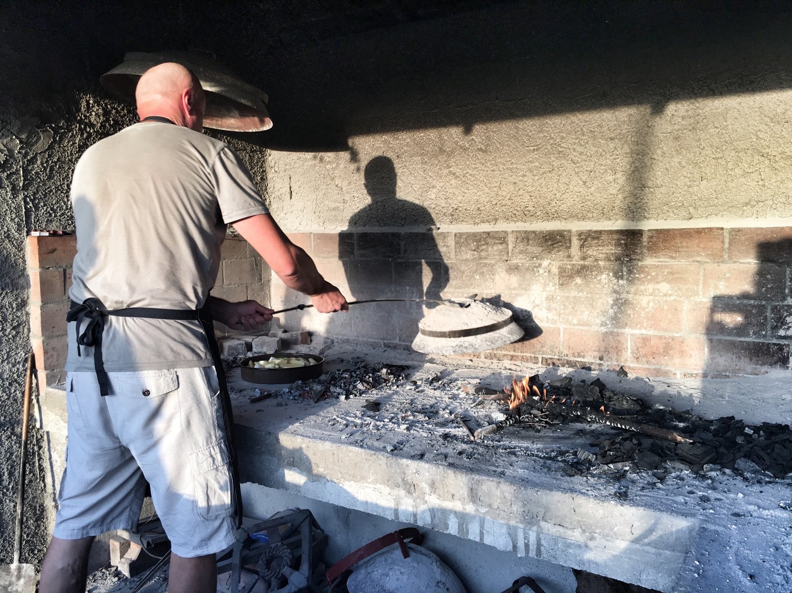 Via Dinarica: Exploring Ravno, Neum, and the Beaches of Bosnia & Herzegovina 7 Davor cooking at Agroturizam Matuško Via Dinarica Blue Trail in Neum, Bosnia & Herzegovina © The Blonde Gypsy