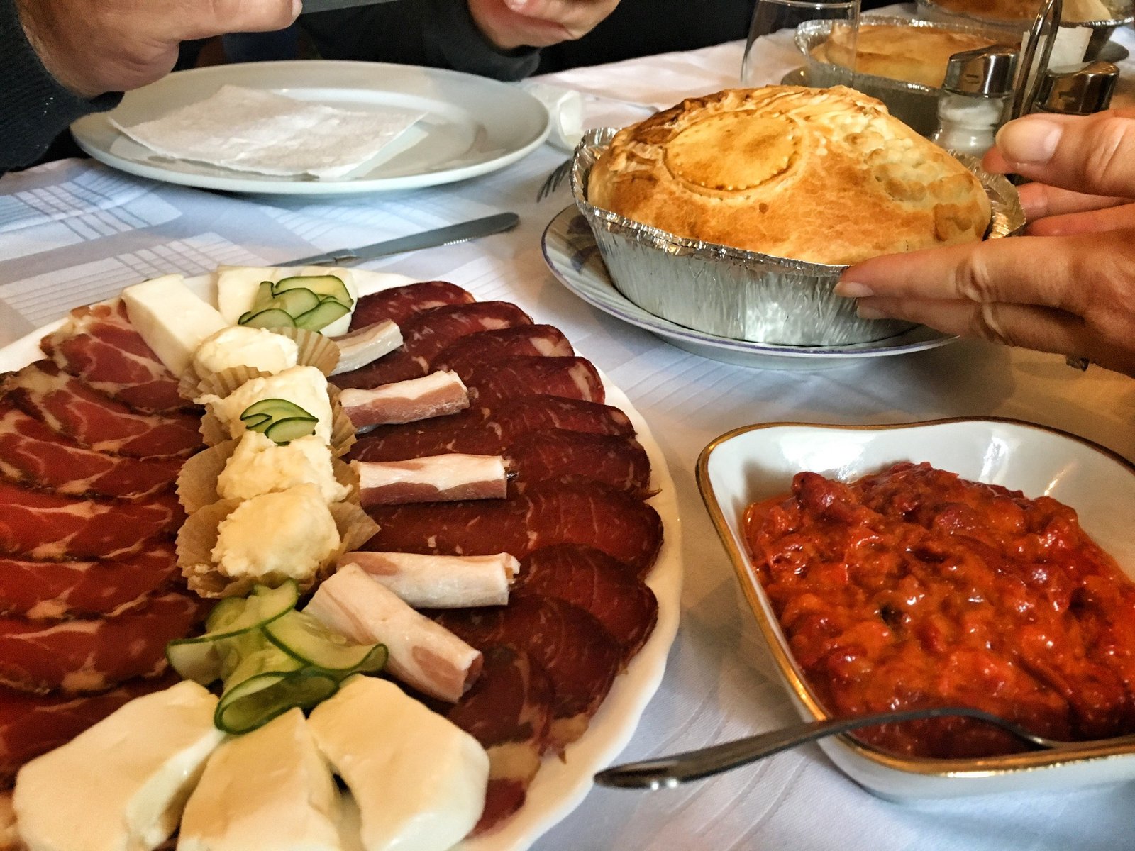 Typical Serbian appetizer spread of meat cheeses and ajvar