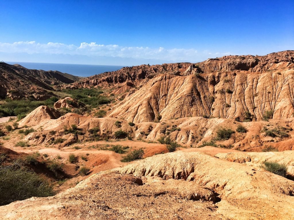 Skazka Canyon lake view of Issyk Kul in Kyrgyzstan © larissa olenicoff