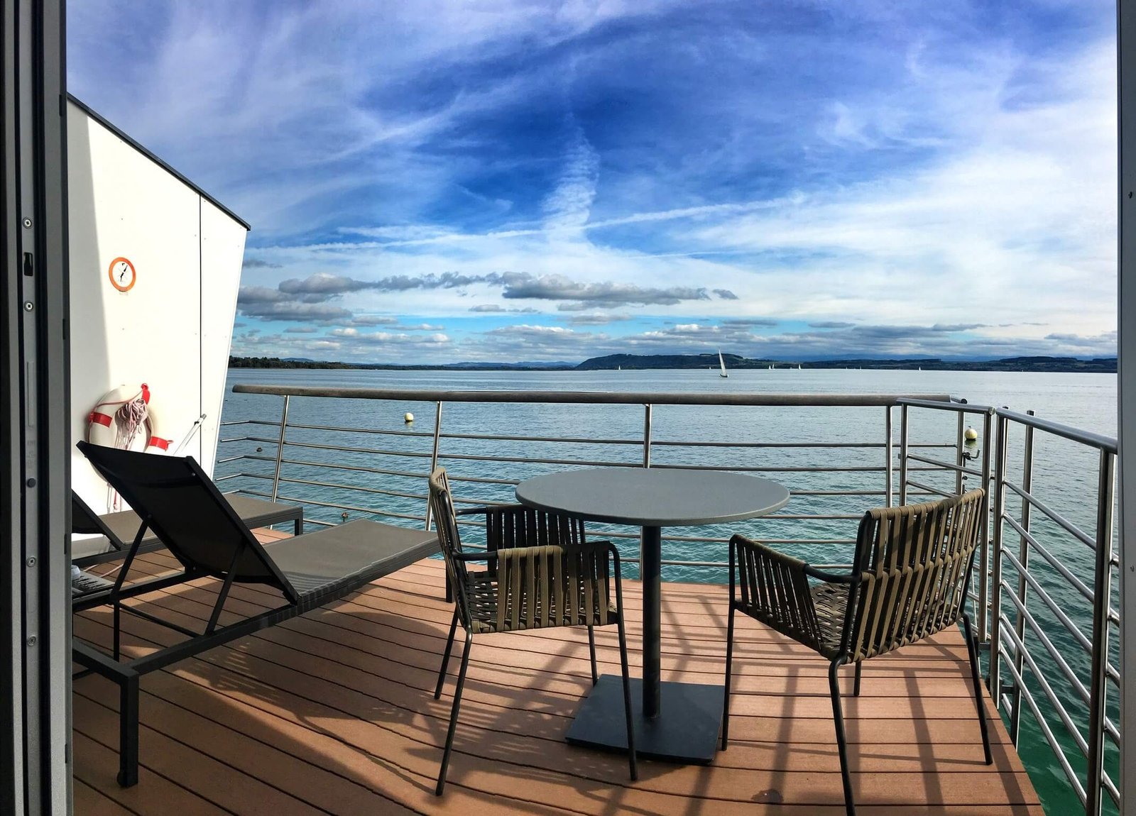 Adventures in Absinthe & Architecture Around Neuchâtel, Switzerland 13 Private terrace on Lake Pavillion at Hotel Palafitte in Neuchatel Switzerland © The Blonde Gypsy